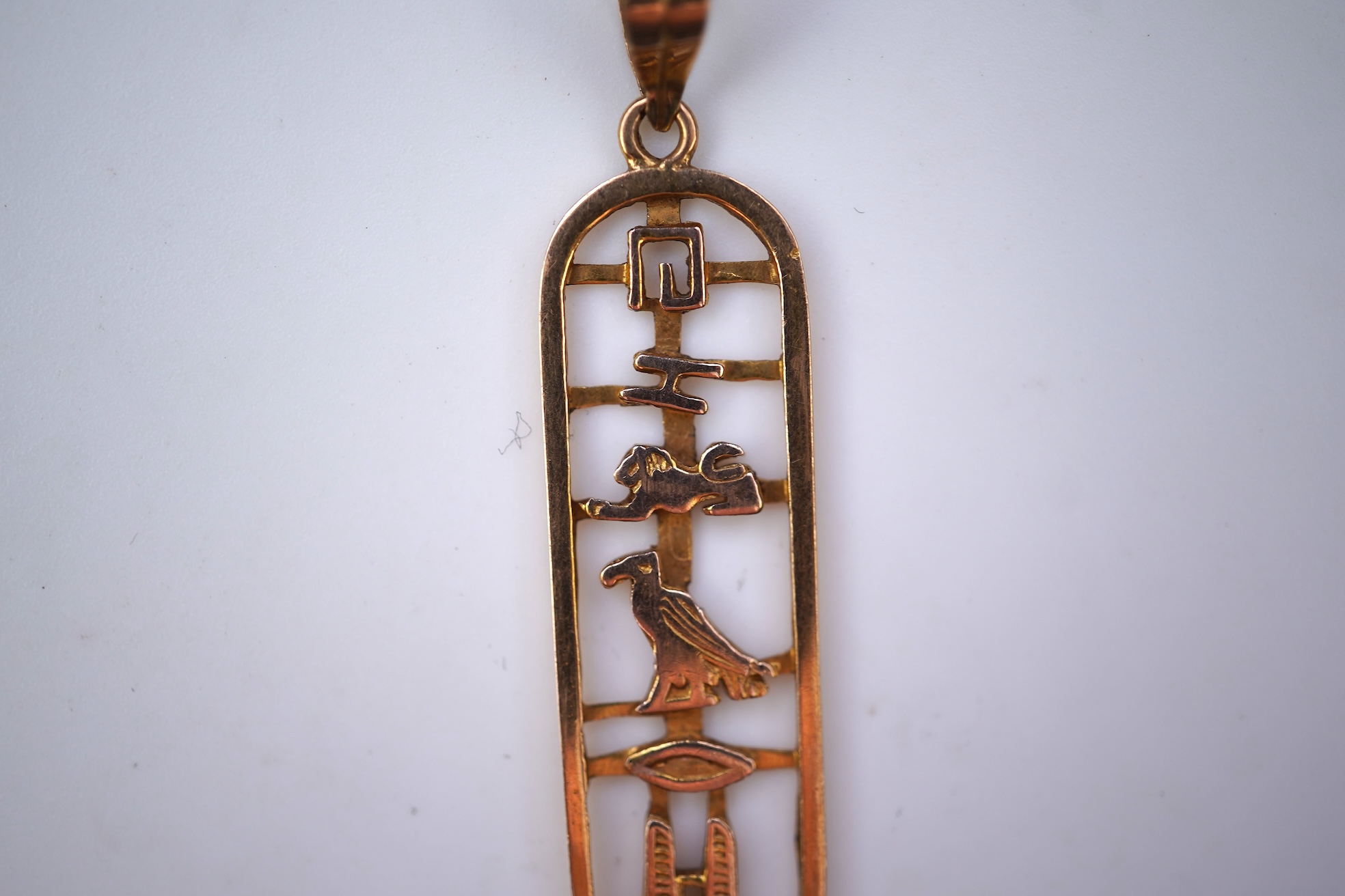 Two gold pendants